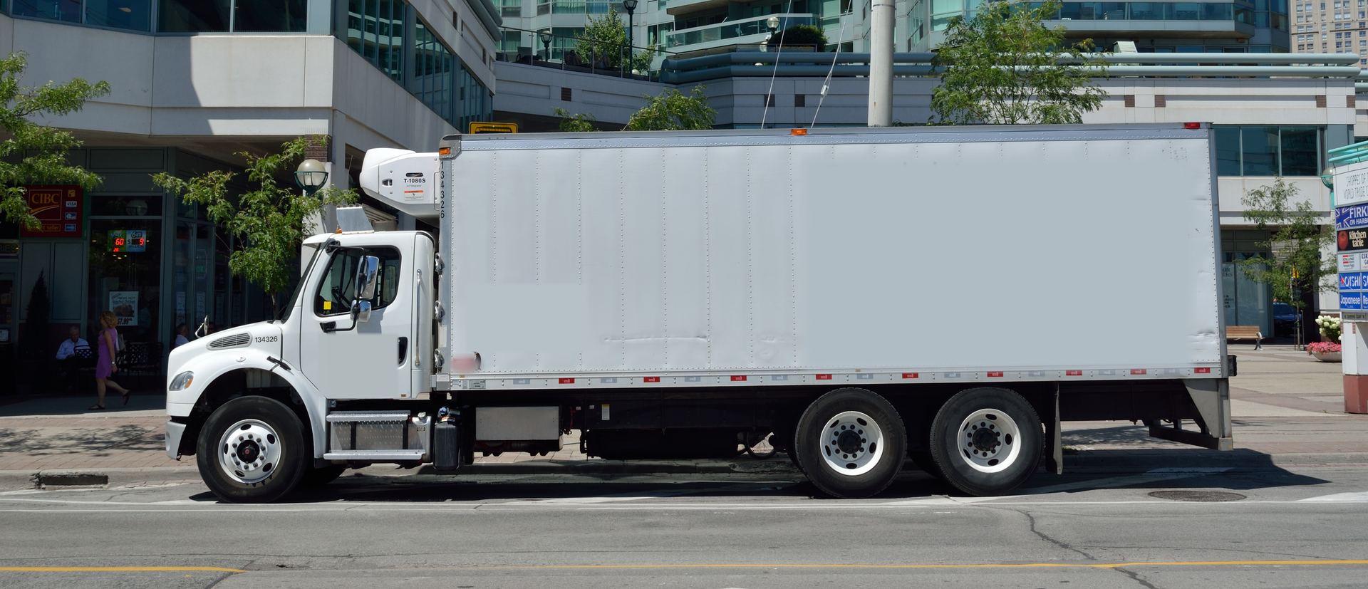 Medium-duty straight truck with a refrigerated box, side view